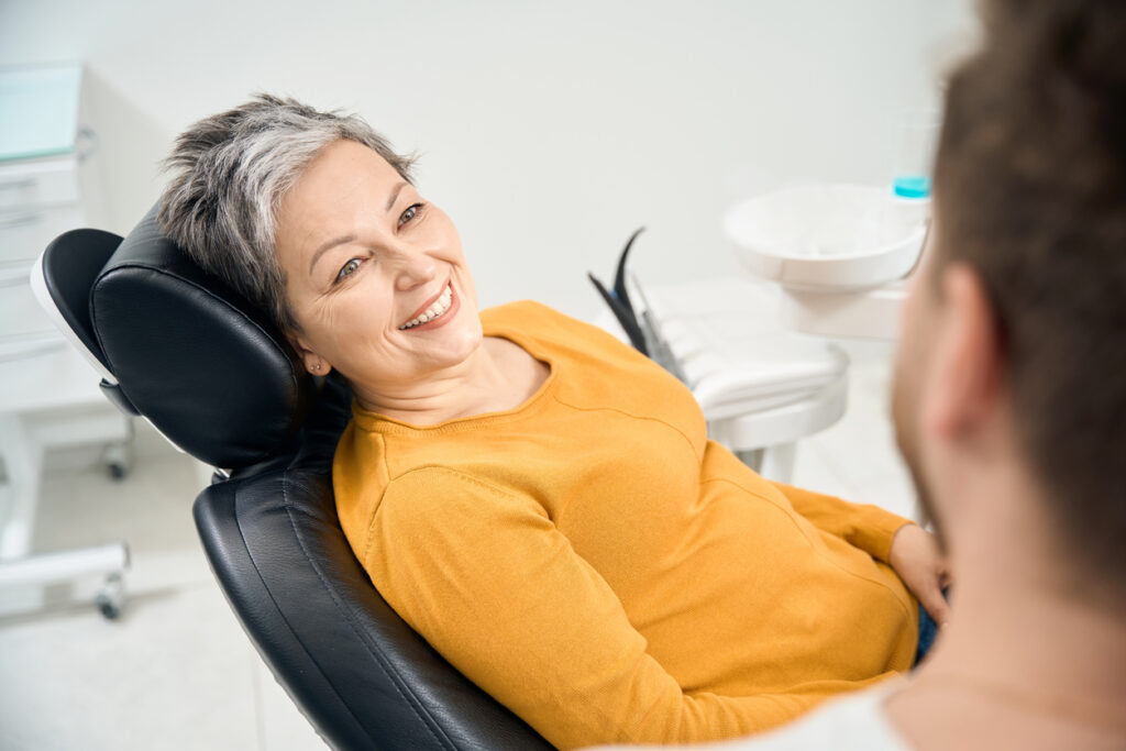 Patient smiling confidently after corrective jaw surgery